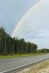 Image showing Rainbow over highway in the summer