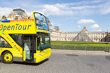 Image showing PARIS - JULY 28, 2013. Excursion bus at the Louvre on July 28, 2