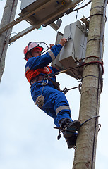 Image showing Electrician perform maintenance on the transmission towers reclo