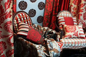 Image showing Luxurious red chairs with satin pillows