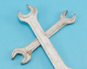 Image showing different size screw spanners wrench tools on blue 