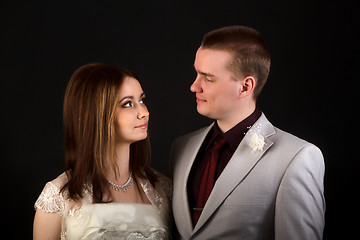 Image showing bride and groom on a black background