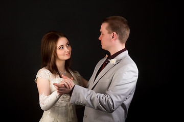 Image showing Happy newlyweds dancing