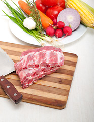 Image showing chopping fresh pork ribs and vegetables