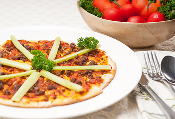 Image showing Turkish beef pizza with cucumber on top