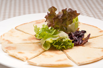 Image showing garlic pita bread pizza with salad on top