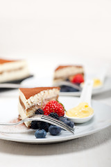 Image showing tiramisu dessert with berries and cream