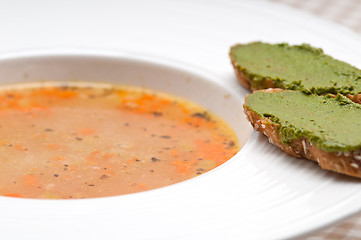 Image showing Italian minestrone soup with pesto crostini on side