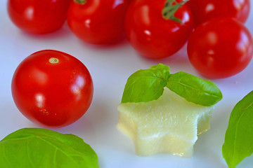 Image showing Italian apppetizer tomatoes with mozarella and basil