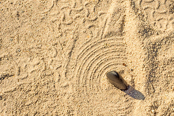 Image showing Zen stone in car tracks