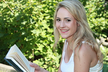 Image showing Beautiful woman reading a book