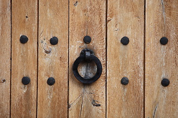 Image showing Door handle or kncker on an old wooden door
