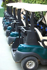 Image showing High quality modern golf carts aligned