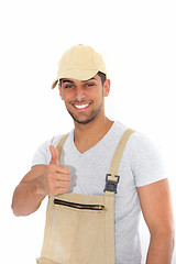 Image showing Confident workman giving a thumbs up