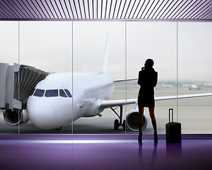 Image showing Silhouette of woman at the airport