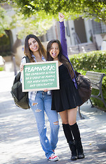 Image showing Mixed Race Female Students Holding Chalkboard With Teamwork and 