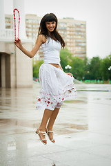 Image showing Jumping smiling girl