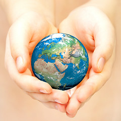 Image showing Hand of the person holds globe.