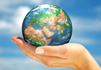 Image showing Hand of the person holds globe.