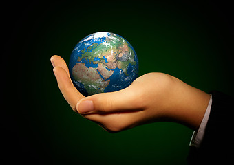 Image showing Hand of the person holds globe.