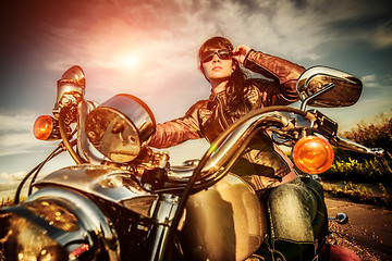 Image showing Biker girl on a motorcycle