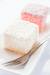 Image showing Close up lamington sponge cakes and fork