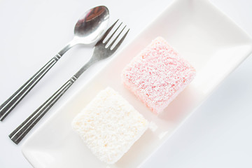 Image showing Set of pink and white lamington sponge cakes 