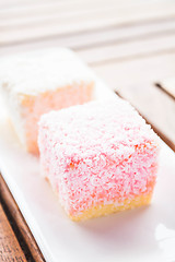 Image showing Lamington cakes on wood table