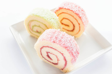 Image showing Colorful jam roll cakes  on the dish 