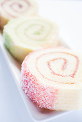 Image showing Colorful jam roll cakes  up close