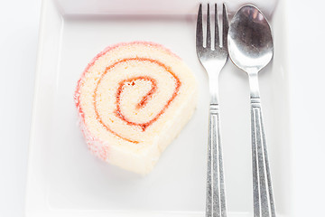 Image showing Strawberry jam lamington roll cake with spoon and fork