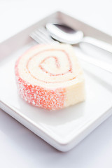 Image showing Sweet dish of pink jam roll cake