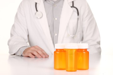 Image showing  Doctor With Empty Orange Prescription Bottles