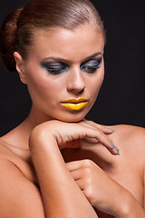 Image showing woman with extreme colorfull make up in blue and yellow