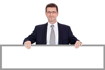Image showing mature smiling businessman holding billboard copyspace isolated