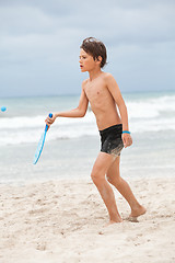 Image showing happy little child kid boy  playing beachball on beach in summer 