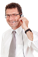 Image showing smiling mature male operator businessman with headset call senter