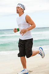 Image showing man is jogging on the beach summertime sport fitness