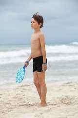 Image showing happy little child kid boy  playing beachball on beach in summer 