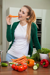 Image showing young woman cooking vegetarian food