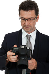 Image showing adult man photographer with digital camera dslr isolated