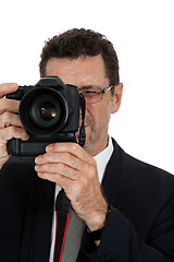 Image showing adult man photographer with digital camera dslr isolated
