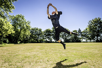 Image showing Jumping American Football Player