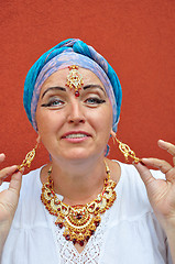 Image showing playful blond senior woman with Indian jewleries