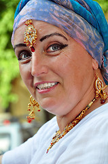 Image showing  senior woman with Indian jewlery in the street