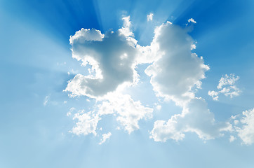 Image showing clouds with sunrays on blue sky