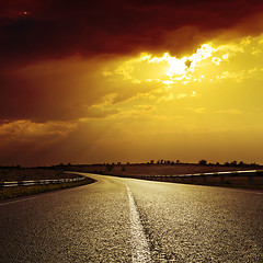 Image showing asphalt road to dramatic sunset