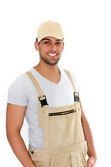 Image showing Handsome man in cap and dungarees