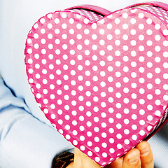 Image showing Businessman hiding a gift