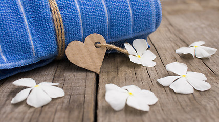 Image showing Rolled up towel and paper heart